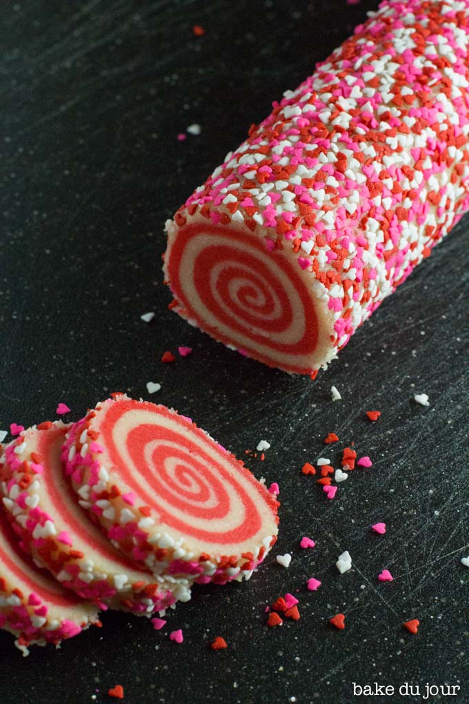 Valentine's Day Pinwheel Cookies - slicing up the dough log