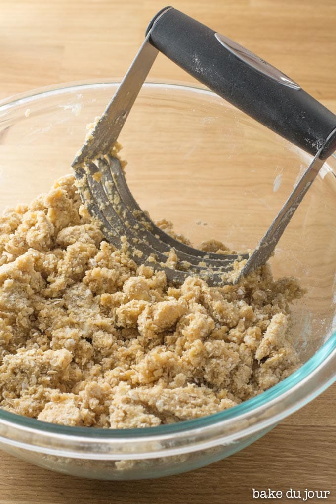 Oatmeal Lemon Cream Bars dough coming together with pastry cutter