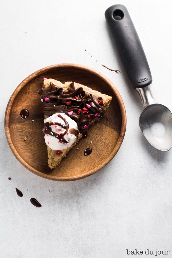 Slice of Valentine's Day Cookie Cake with ice cream on top