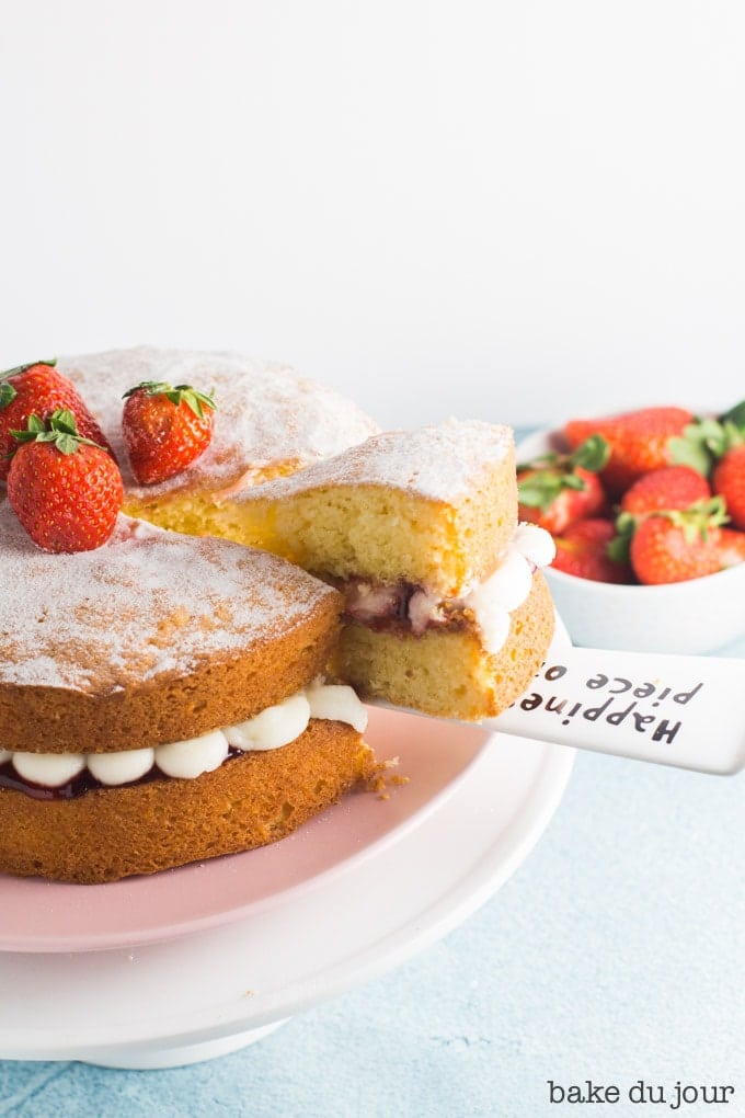 Cutting a slice of the Victoria Sandwich Cake