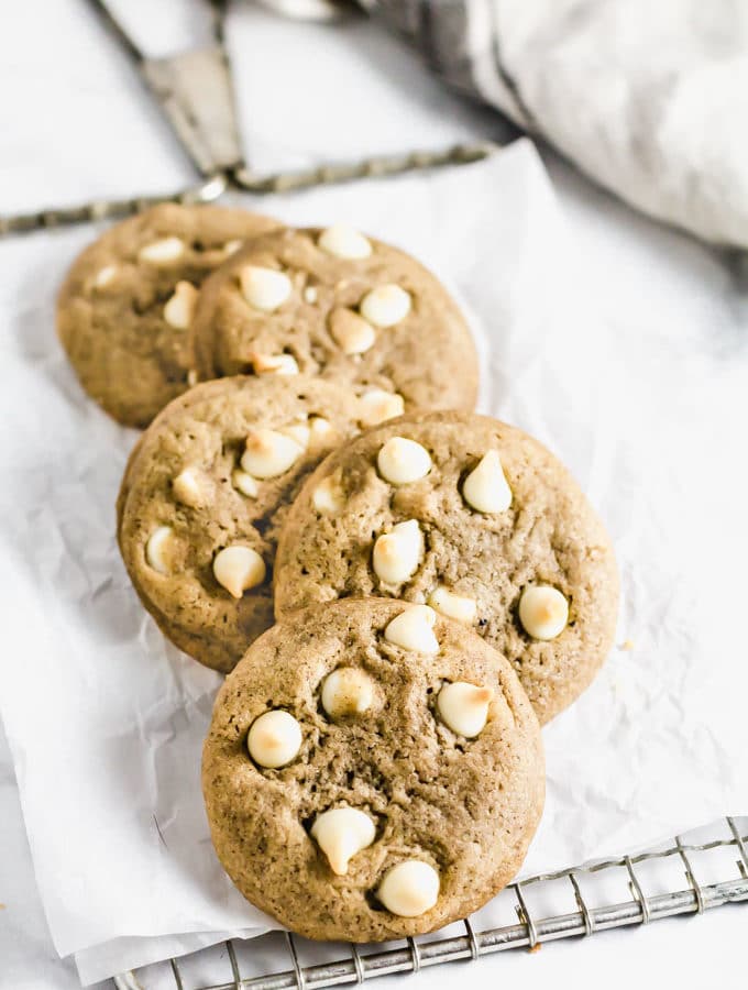 5 White Chocolate Chai Cookies layered on top of each other on cooling rack